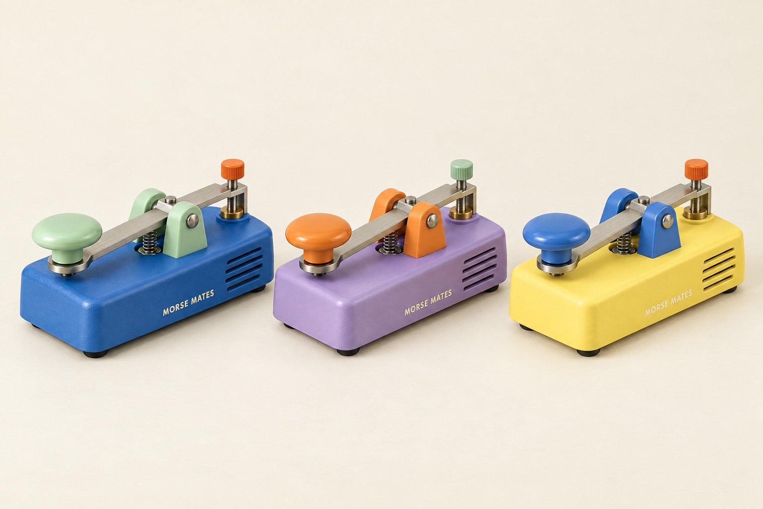 Three Morse Mates keys: blue with mint fittings, lilac with orange fittings, and lemon with blue fittings